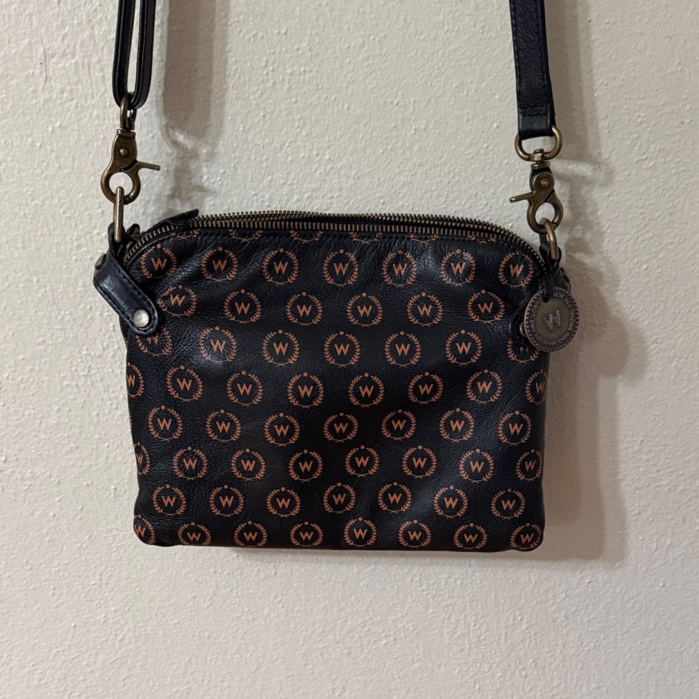 Wanderers Travel Co. Venetian Passport Crossbody Bag in Black and tan.